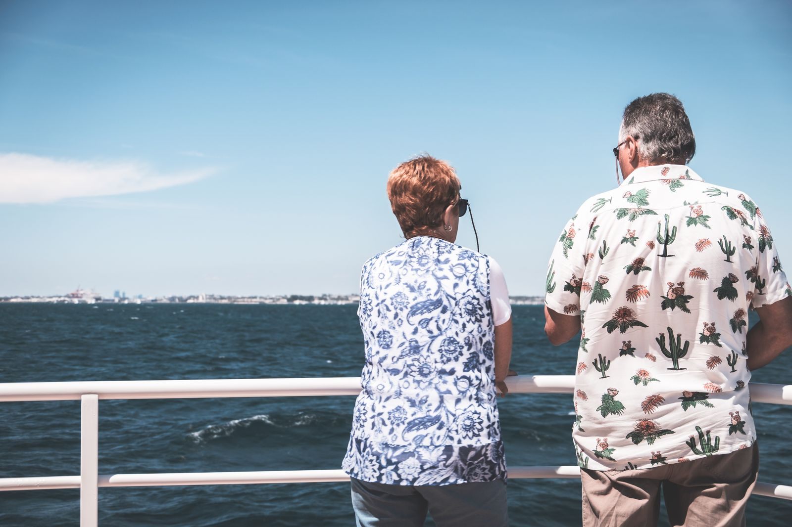 Mature couple relaxing on the deck of a ship at sea